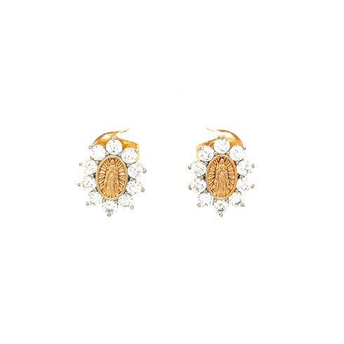 Introducing the Virgin Mary Stud Earrings, meticulously crafted in 14k rose gold-filled metal. These stunning earrings showcase an oval centerpiece with an engraved design, gracefully adorned with clear zirconia stones arranged in a floral motif against a simple white background to enhance their delicate charm.
